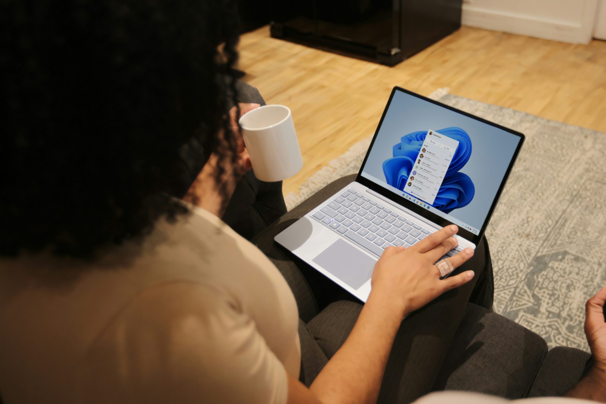 woman looking at her laptop, thinking about Microsoft 365